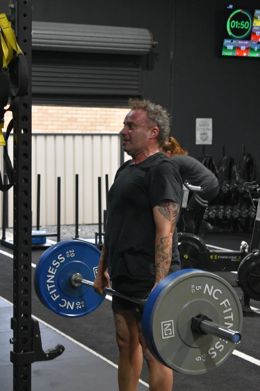 Member performing a barbell deadlift at Altona North Training