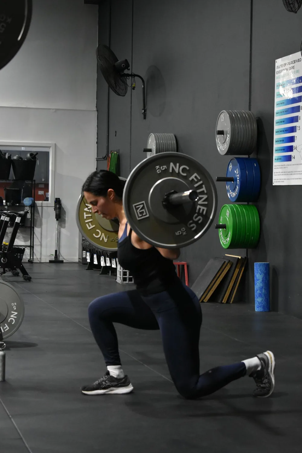 Member doing a barbell lunge